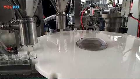 Automatic dual head rotary syrup filling capping machine