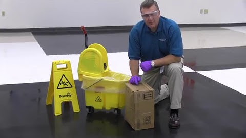 Applying Floor Finish using a mop and bucket
