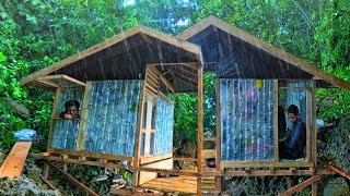Camping adventurers build bottle houses in heavy rain
