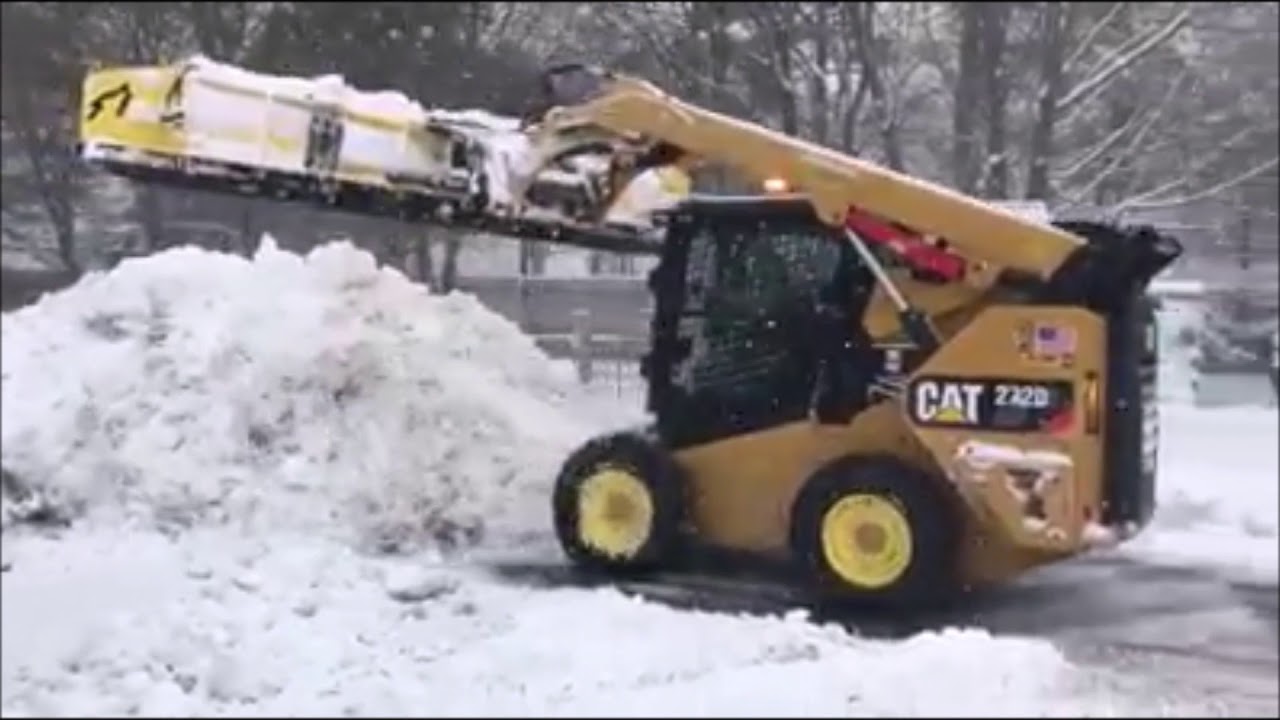 Customer Video: Fine Design Landscaping using a SnowWolf QuattroPlow, WolfPaws on CAT 272D