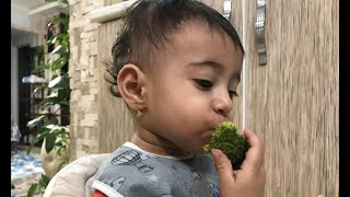 My Little Girl's First Taste of Broccoli - A Sweet and Adorable Moment!