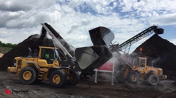 MH5680 stockpiling mulch from wheel loaders & grinder