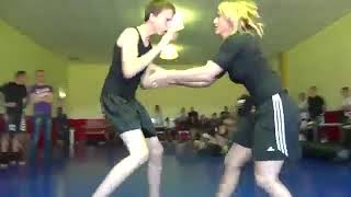 Blonde girl dominating guy in wrestling match