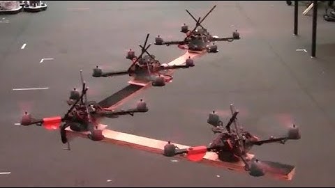 Cooperative Grasping and Transport using Quadrotors