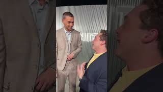 Jake Shane and Tyriq Withers share a hug at Vanity Fairs Young Hollywood red carpet