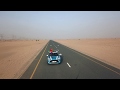 Slow Motion Vehicle Moving In Desert Road Drone Cam Shot 