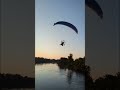 Moment paraglider flies straight into power lines