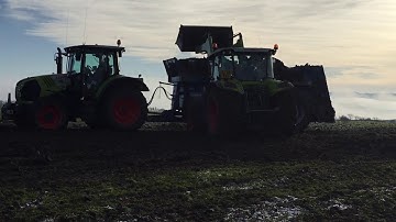 Claas loading dung spreader at Blackerne farm Castle Douglas