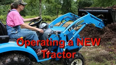 1st Time Woman Operates Tractor with Front End Loader