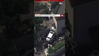 Two taken into custody after car slams into home on Staten Island