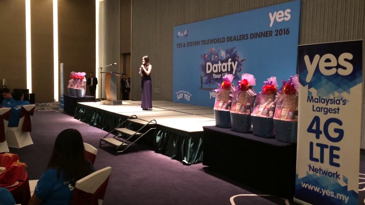 Emcee Ruby hosting YES Dealer Dinner