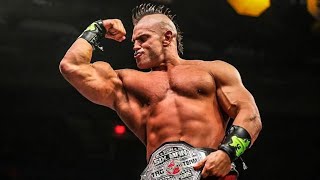 Brian Cage flips out of the ring