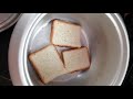 Breakfast with bread and eggs in electric rice cooker