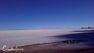 Majestic Tunupa and Uyuni Salt flats from Tahua. Drone view.