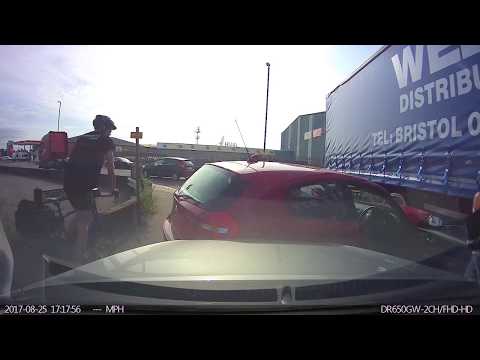 Lorry takes bad line and wipes 2 cars out.