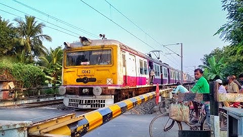 Busy Public Waiting at Railgate | Honking Colourful local Train Speedily skip Level Crossing