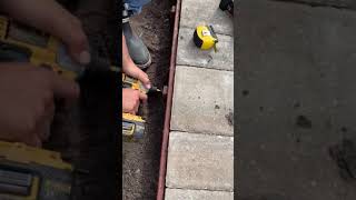 Setting your Artificial Turf Edge with Bender Board Against Pavers