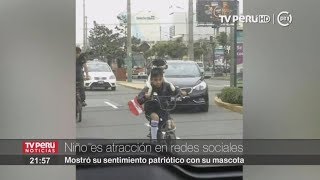 Niño que pasea en bicicleta junto a su perra es la sensación de las redes sociales