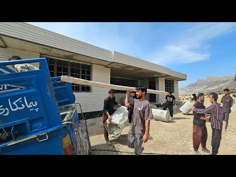 The final day of plastering; Ali bids farewell to the craftsmen who put in the hard work.