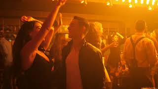 Couple Dancing In Nightclub A Couple Dancing Together In A Nightclub. There Are Disco Lights