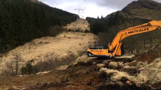 Time lapse Hyundai 300 stripping peat for a hydro pipeline at dalmally Scotland