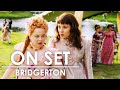 Behind the Scenes of Bridgerton with Phoebe Dynevor, Claudia Jessie & More | On Set