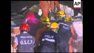 Rescue workers continue search for survivors into the night