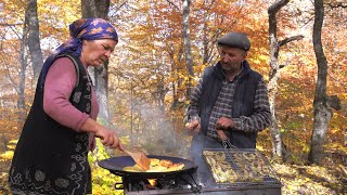 Cooking Whole Sturgeon Fish on Charcoal in the Forest