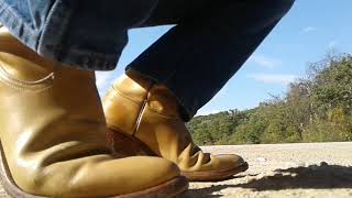 Cowboy in Boots, Walks and Squats to Remedy Truck by the Lake