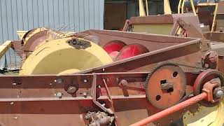 old self-propelled New Holland swather
