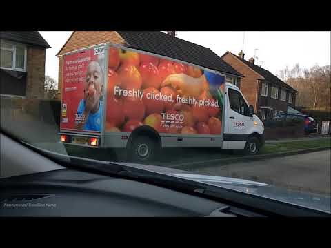 Moment  delivery driver gets stuck after parking on grass verge