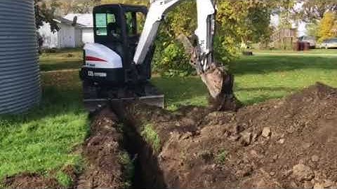 Bobcat excavator trenching