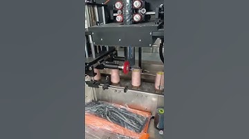 Automatic yarn roll shrink sleeve wrapping machine