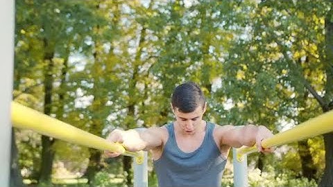 Athlete On Gymnastic Parallel Bars Stock Video