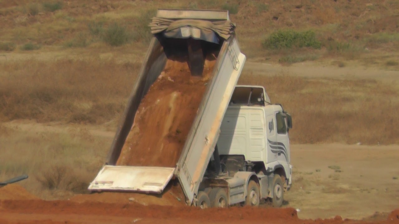 Dump Truck Unloading Sand 