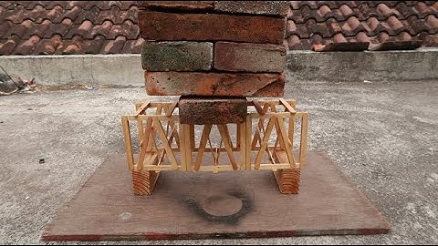 making a truss bridge with popsicle sticks & testing it!