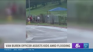 Kindness of Van Buren Police Officer Caught on Camera as He Carried Kids Over Flooded Ditch