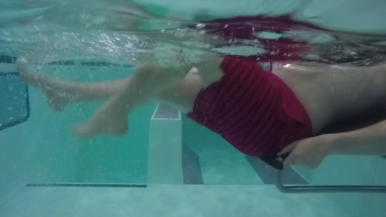 A patient rehabilitating in the pool from ACL reconstruction surgery