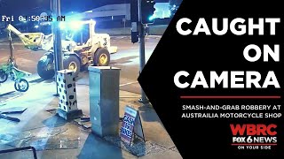 Caught On Camera Man Uses Front-End Loader To Break Into Motorcycle Shop