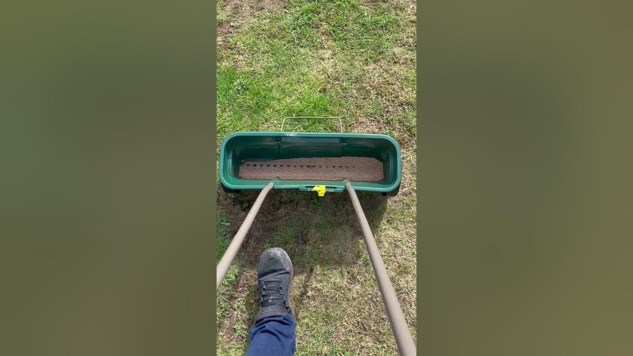 Using A Garden Spreader To Apply Moss Killer To Your Lawn Is Easier