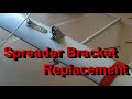 Mast spreader bracket replacement