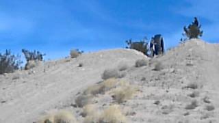 rolling guy in tire down hill