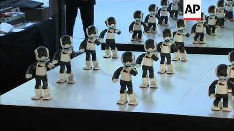 100 mini humanoids perform dance routine