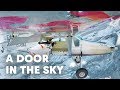 2 wingsuit flyers base jump into a plane in midair  a door in the sky