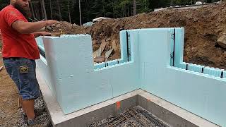Stacking Nudura ICF Basement Walls Bracing With Zonts and Zuckles and Pouring Concrete Pump Truck