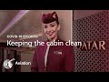 Cleaning the aircraft cabin interiors of a Qatar Airways aircraft