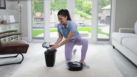 How do I maintain the dust bin and filter on the Shark IQ Robot™?