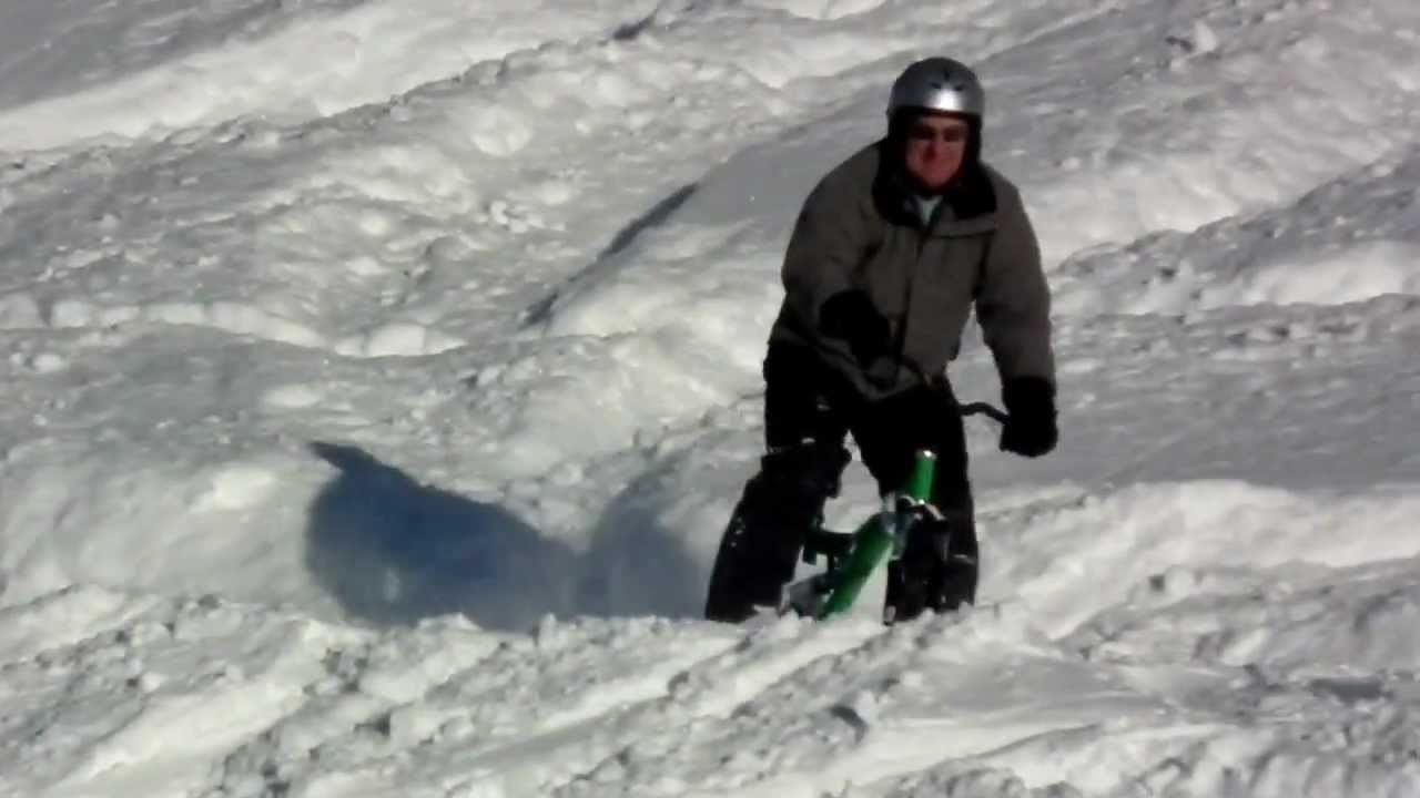 Ski Bike making figure of 8's in powder snow