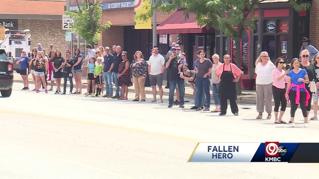 Armour Boulevard in North Kansas City lined with residents showing support for fallen officer