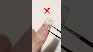 Is the big nail charm and rhinestone hard to remove?